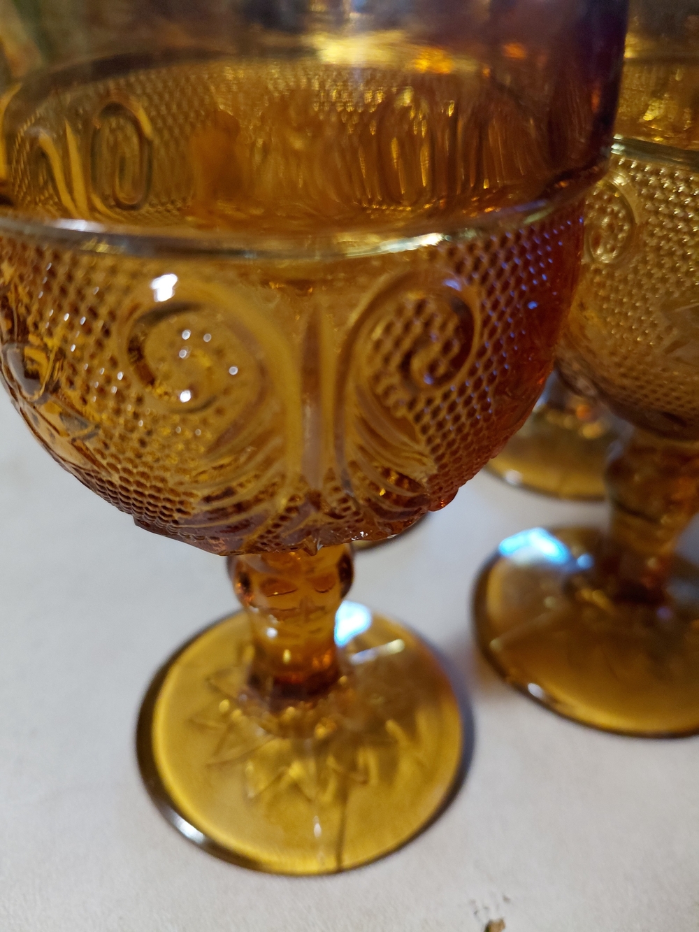 Tiara Amber Pressed Glass Goblets - Embossed Scroll Pair